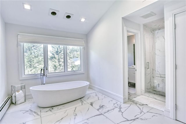 bathroom with shower with separate bathtub and a baseboard heating unit