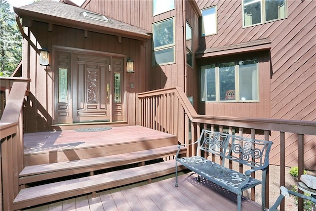 doorway to property featuring a deck