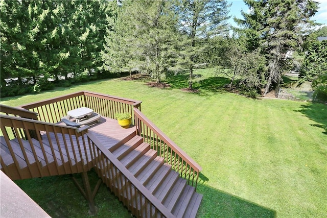 wooden deck with a yard