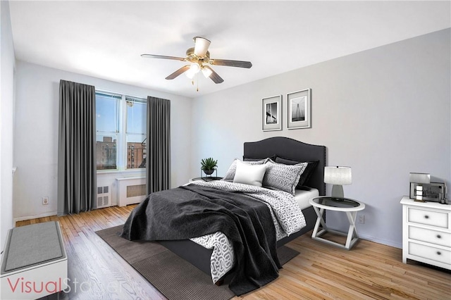 bedroom featuring light hardwood / wood-style flooring and ceiling fan