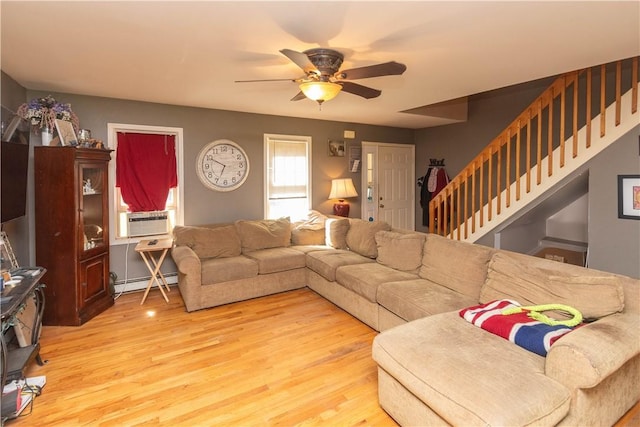 living room featuring light hardwood / wood-style floors, a baseboard radiator, cooling unit, and ceiling fan