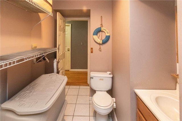 bathroom with tile patterned floors, vanity, and toilet