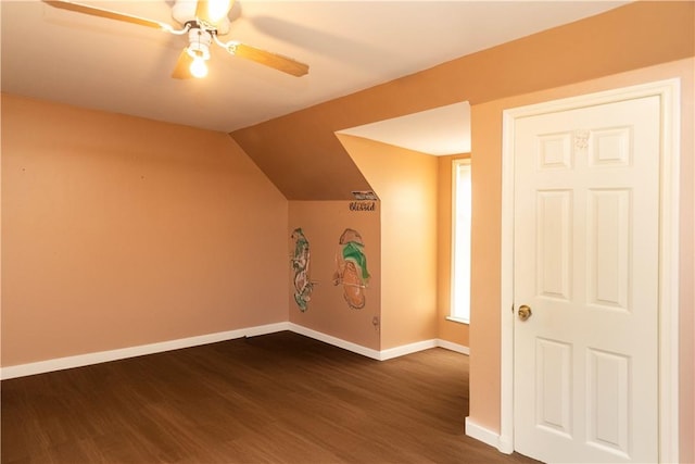 bonus room with ceiling fan, dark hardwood / wood-style flooring, and lofted ceiling