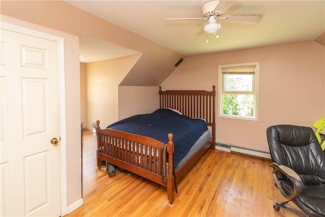 bedroom featuring baseboard heating, ceiling fan, vaulted ceiling, and light wood-type flooring