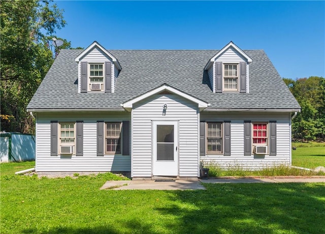 new england style home featuring a front lawn