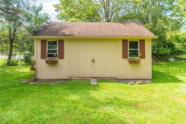 view of outdoor structure with a lawn