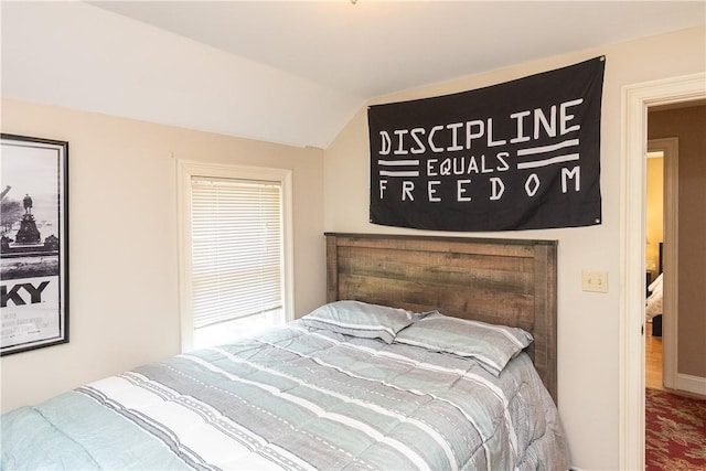 bedroom featuring vaulted ceiling