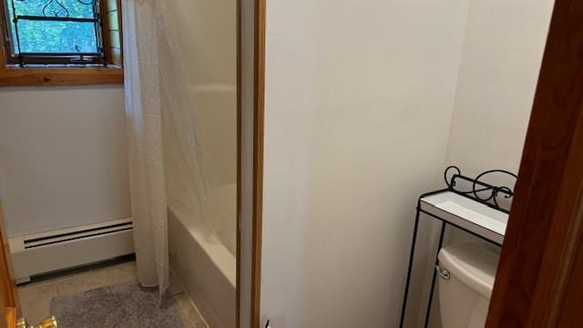 bathroom featuring baseboard heating, shower / bathtub combination with curtain, and toilet