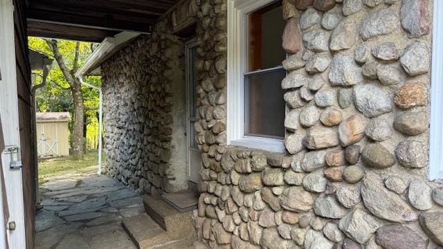 view of home's exterior featuring a storage shed