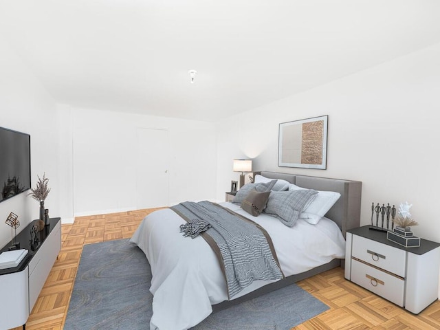 bedroom with light parquet floors