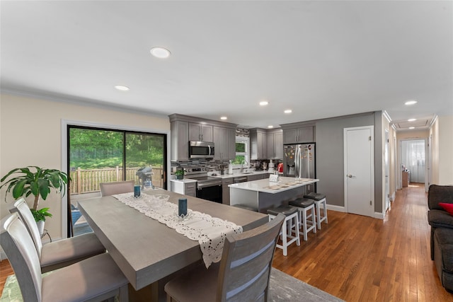 47 Riverside Rd, Newtown, CT 06482 - dining room with recessed lighting, ornamental molding, and light wood-style floors