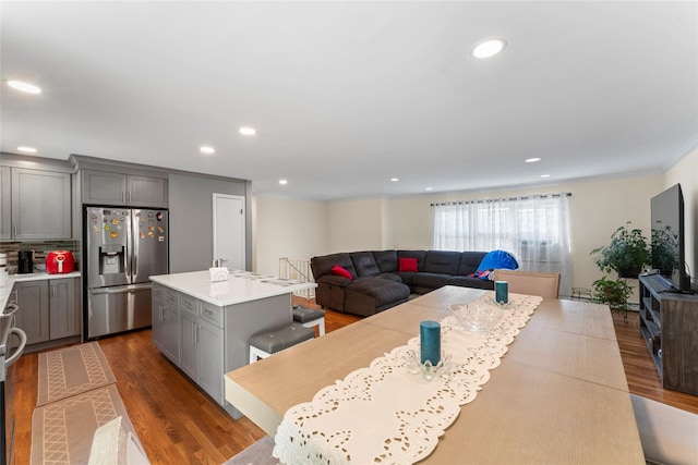 47 Riverside Rd, Newtown, CT 06482 - kitchen with stainless steel fridge, gray cabinets, dark wood-type flooring, a kitchen island, and tasteful backsplash
