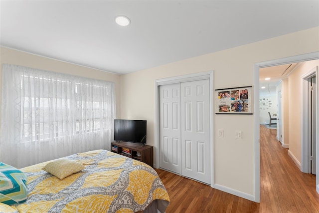 47 Riverside Rd, Newtown, CT 06482 - bedroom with attic access, wood finished floors, and a closet