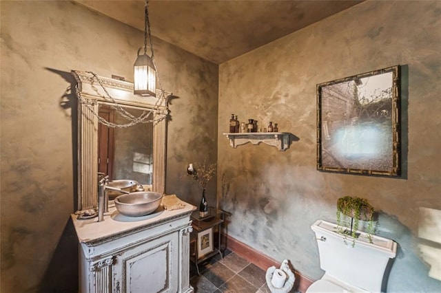 bathroom featuring vanity and toilet