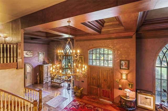 foyer entrance featuring a healthy amount of sunlight, an inviting chandelier, beam ceiling, and coffered ceiling