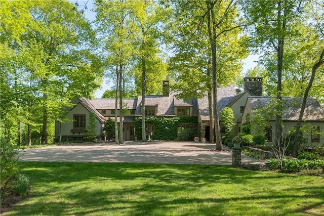 rear view of house with a lawn