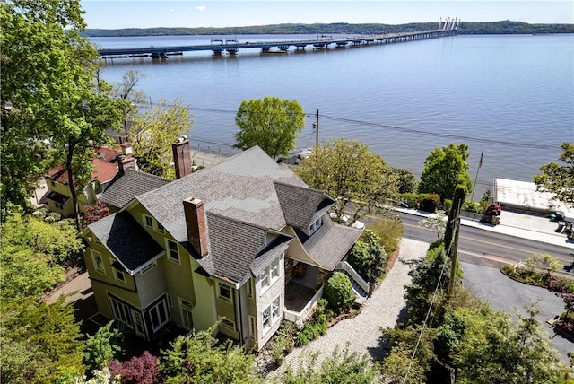 birds eye view of property featuring a water view