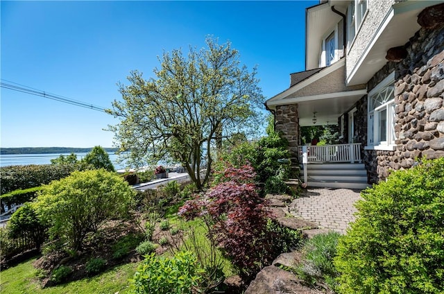 view of yard with covered porch