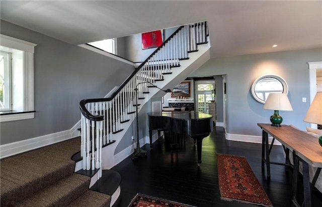 stairs with hardwood / wood-style floors