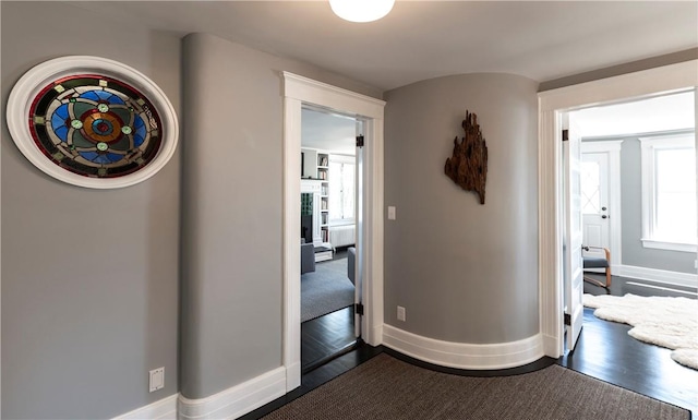 corridor with dark wood-type flooring