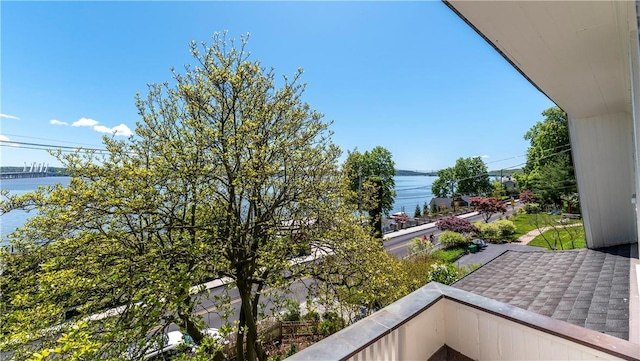 balcony featuring a water view