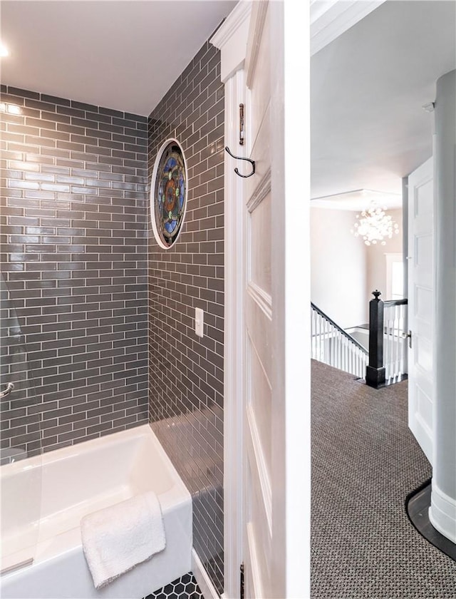 bathroom featuring tiled shower / bath combo and tile patterned floors