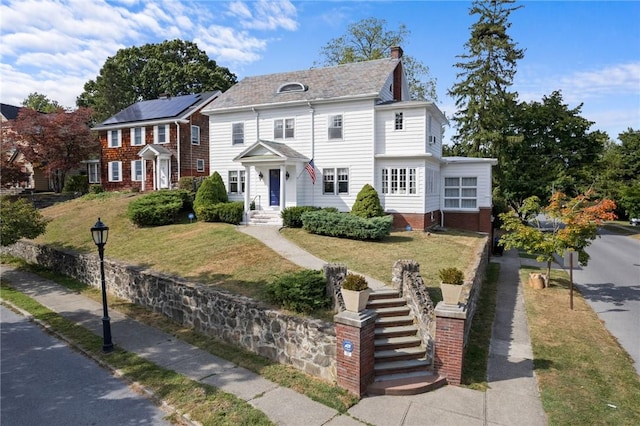 view of front of property with a front lawn