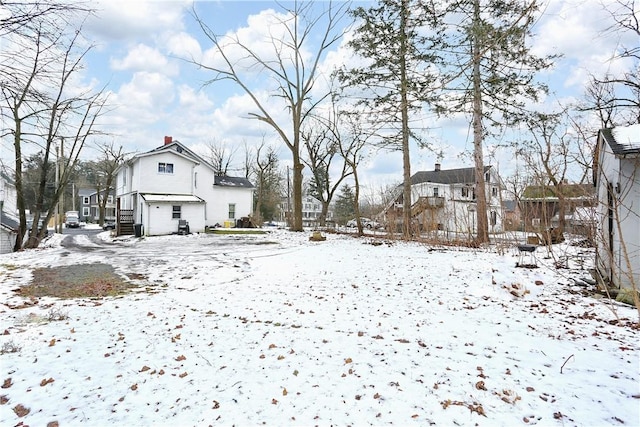 view of yard covered in snow