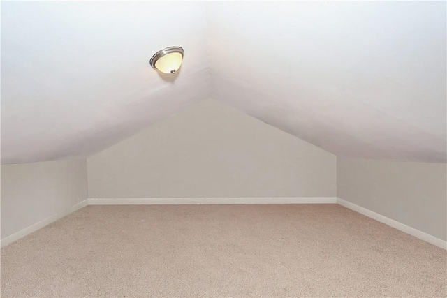 bonus room with carpet and lofted ceiling