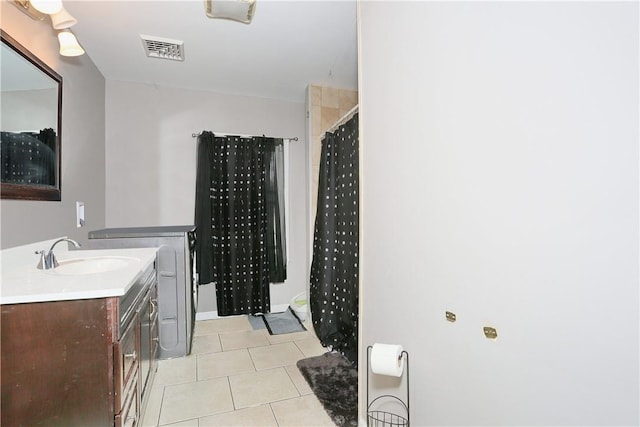 bathroom with tile patterned floors, vanity, and a shower with shower curtain