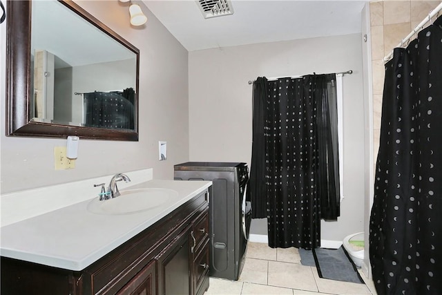 bathroom with tile patterned flooring, vanity, and a shower with shower curtain