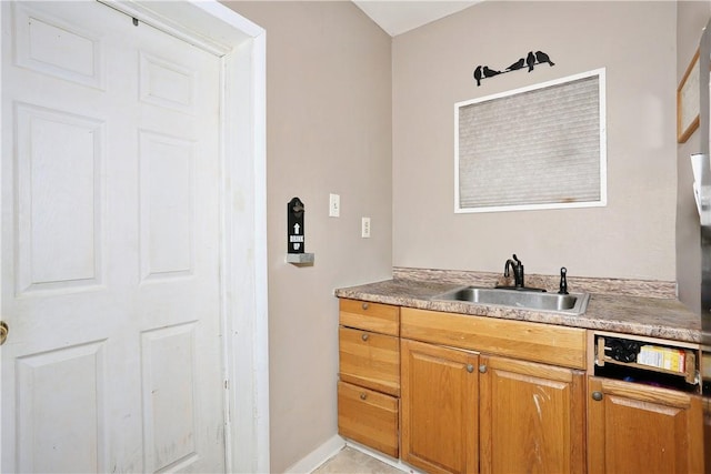 bathroom with tile patterned flooring and vanity