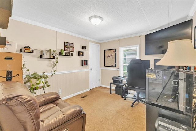 office featuring carpet flooring, ornamental molding, and a textured ceiling