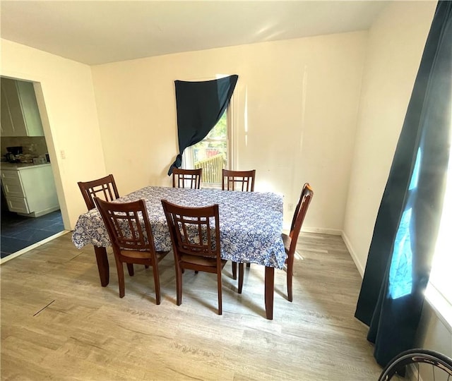 dining room with light wood-type flooring