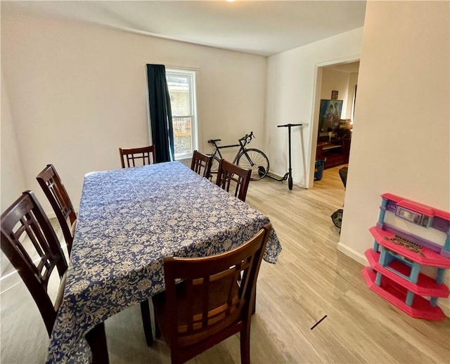 dining area with light hardwood / wood-style floors