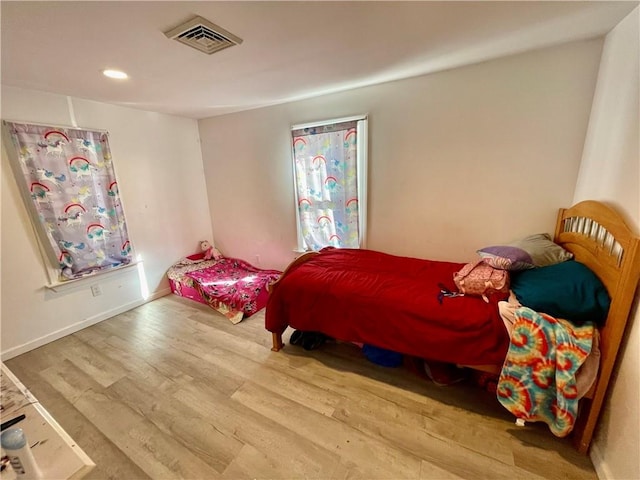 bedroom featuring hardwood / wood-style flooring