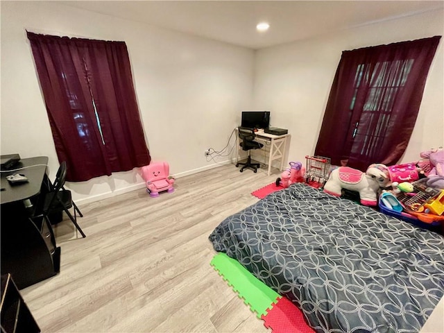 bedroom with light hardwood / wood-style floors