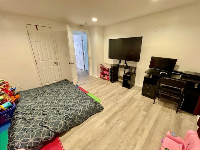 recreation room with wood-type flooring