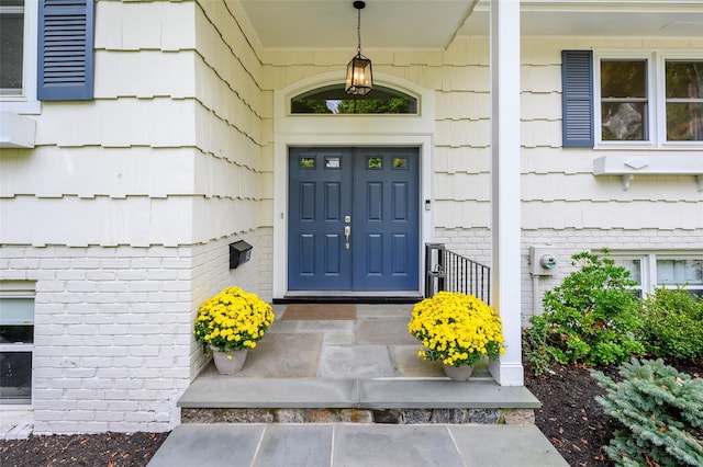 entrance to property with brick siding