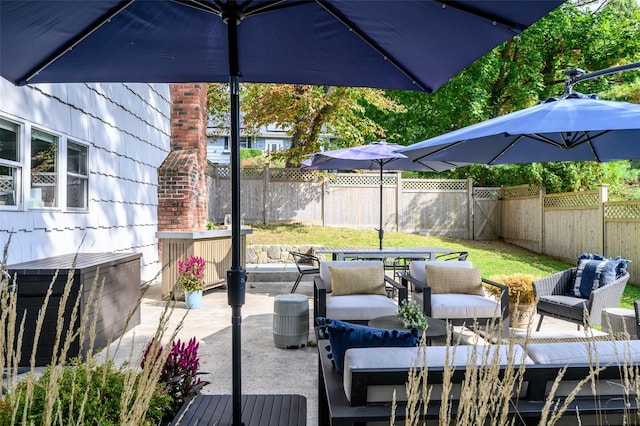 view of patio / terrace featuring an outdoor living space and a fenced backyard