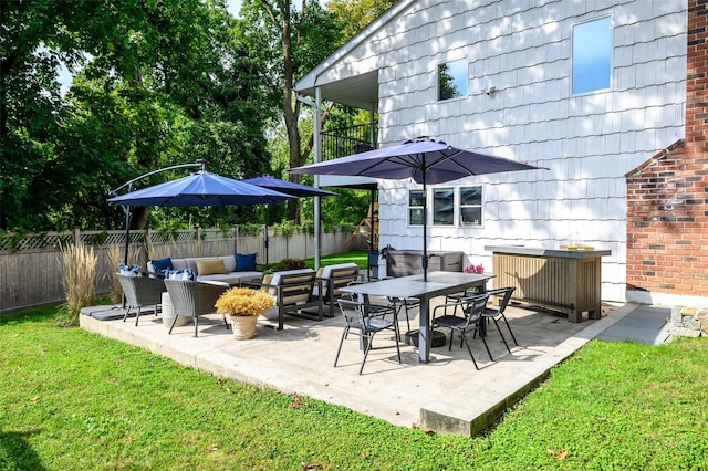 view of patio featuring outdoor lounge area and fence