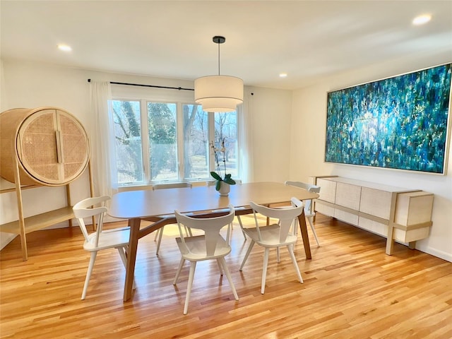 dining space featuring recessed lighting and light wood finished floors