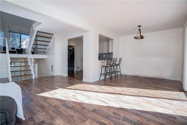 living room with dark hardwood / wood-style flooring