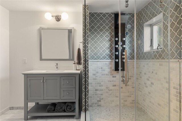 bathroom featuring vanity and an enclosed shower