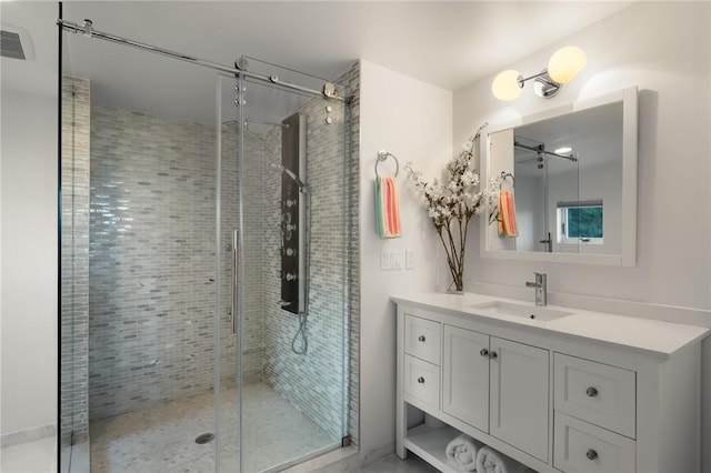 bathroom featuring vanity and an enclosed shower