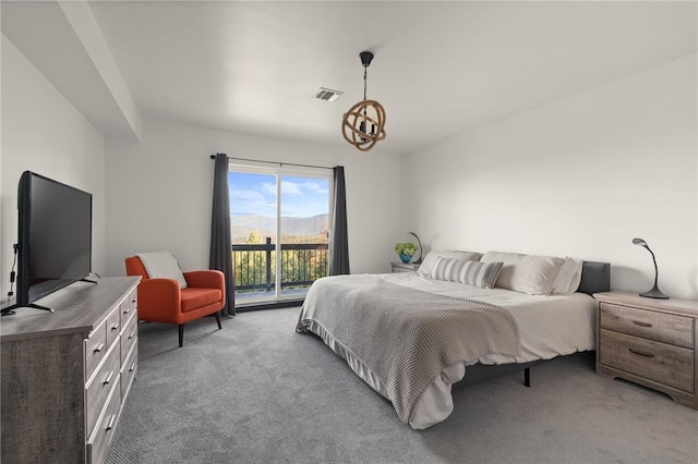 carpeted bedroom featuring access to outside