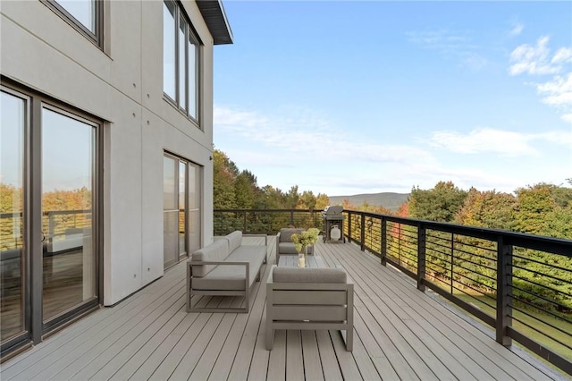 wooden deck with outdoor lounge area