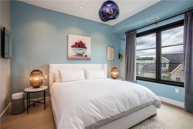 bedroom featuring light wood-type flooring