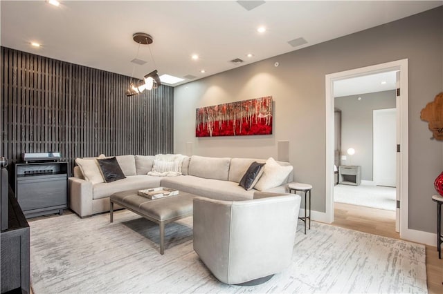 living room featuring a chandelier and hardwood / wood-style flooring