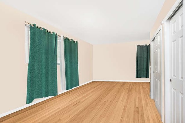 spare room featuring light hardwood / wood-style flooring